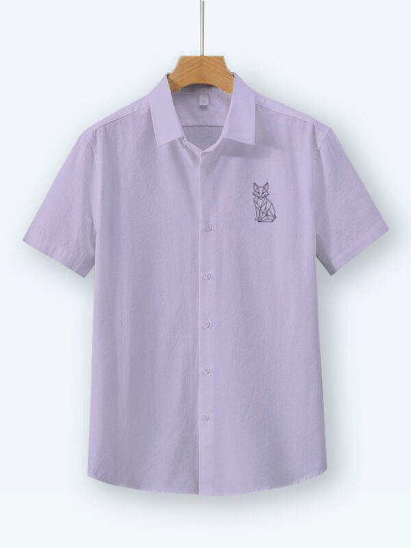 Lavender oversized cotton shirt with geometric fox embroidery on the chest, displayed on a wooden hanger.
