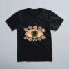 Black unisex T-shirt with artistic eye graphic print in muted tones – All-Seeing Gaze Tee by LIVNT