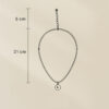 LIVNT Celestial Curve Necklace size chart showing 21 cm chain length with 5 cm extender on beige background