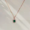LIVNT Emerald Glow Necklace in 18K rose gold with emerald-green cubic zirconia and anti-tarnish finish.