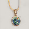 LIVNT Verdant Circle necklace featuring 18K gold plated pendant with hand-painted blue and green enamel botanical design on flat chain