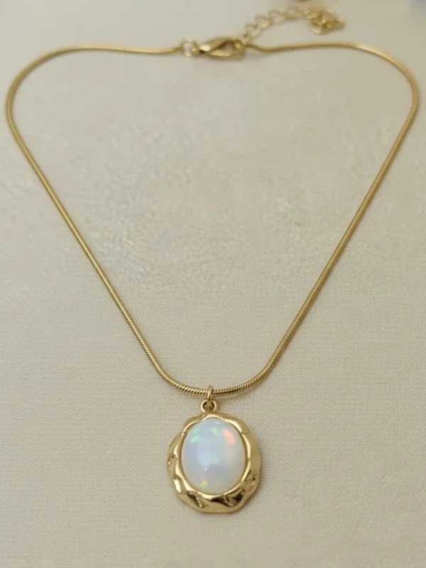 The Pebble Anti-Tarnish Necklace with its gold snake chain angled on a clean white background.