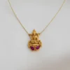 Front view of a traditional South Indian Goddess Lakshmi locket crafted in matte gold, featuring two oval ruby-toned Kemp stones, hung on a barely visible gold micro-chain against a clean white backdrop.