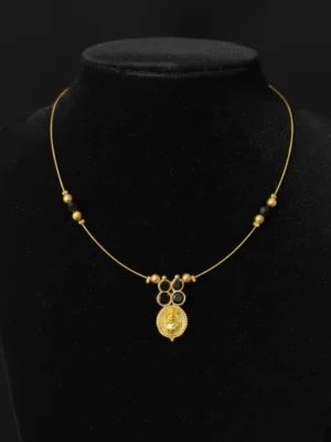 Front view of the Mangal Invisible Chain necklace displayed on a black bust, highlighting the central kasu coin and clover motif.