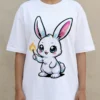 Close up detail of rabbit graphic on white t-shirt worn by a model, showing high-quality print and fabric drape.